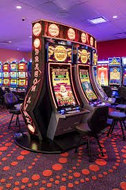 Colorful slot game reels displayed on mobile and desktop screens